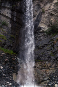 Cyr wheel under a tall waterfall Cyr wheel under a tall waterfall