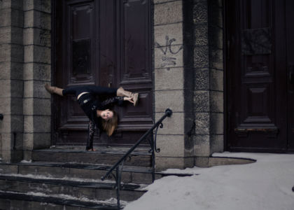 Splits upside-down Splits upside-down in front of a door